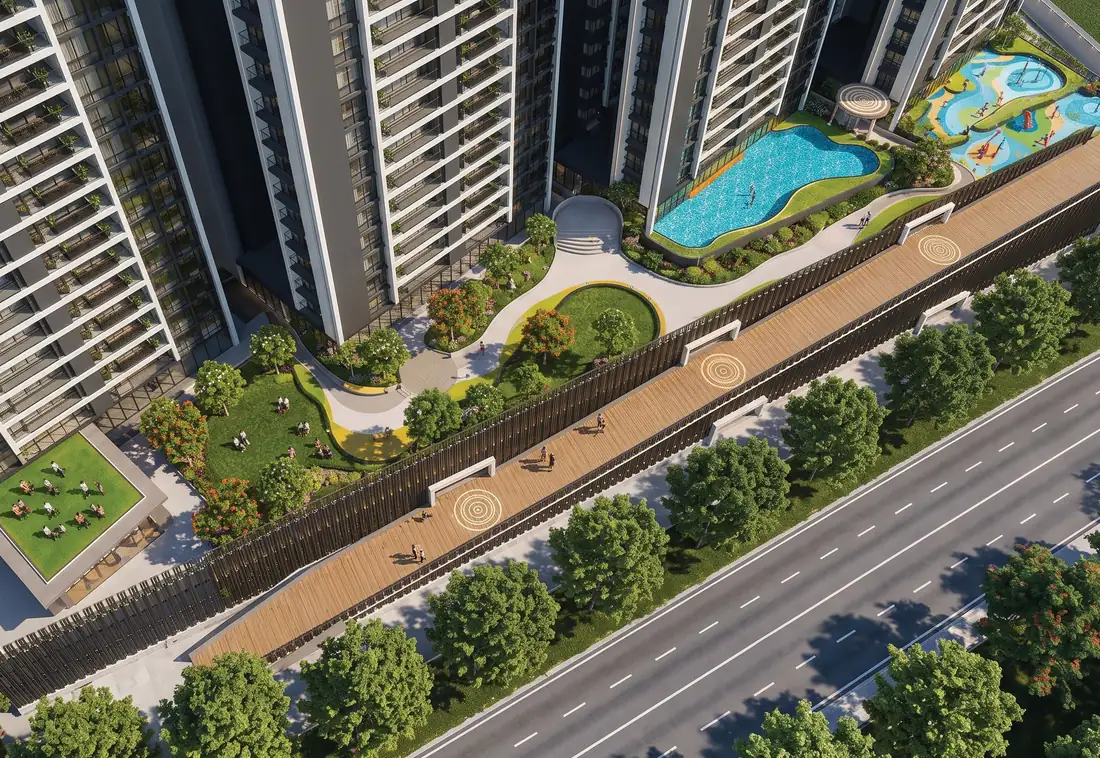 Aerial view of the landscaped podium at Prime Mundhwa, with the swimming pool, lawns and the approach road